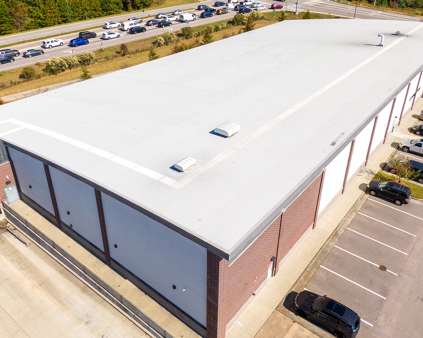 Flat low slope roof coating applied on Mesa commercial building
