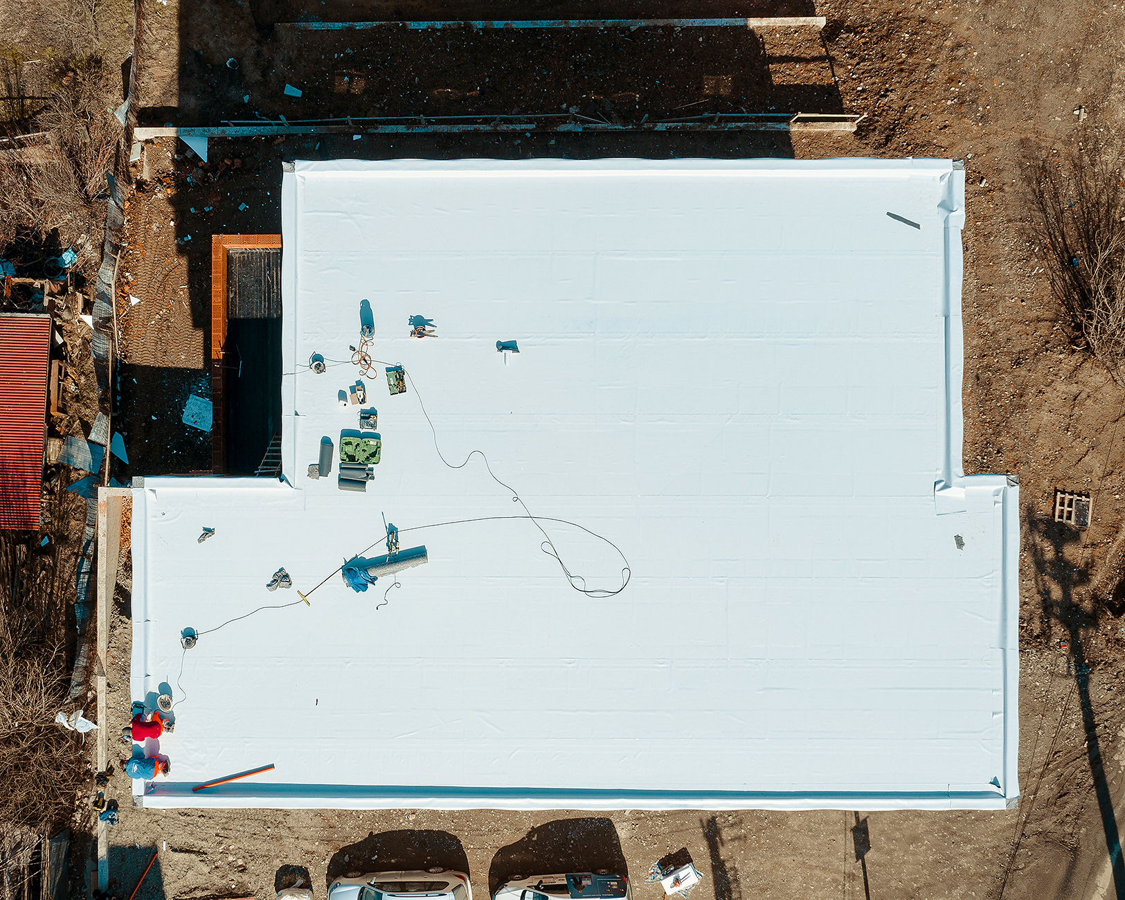 Roof coating rolled at seam detail on Scottsdale flat roof